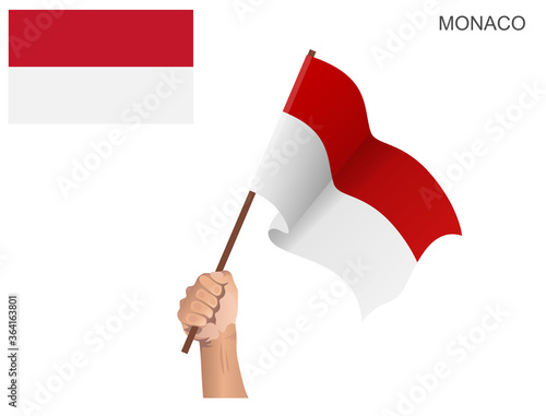 Flag of the State of Monaco hoisted with a stick held by hand to ignite the spirit of statehood