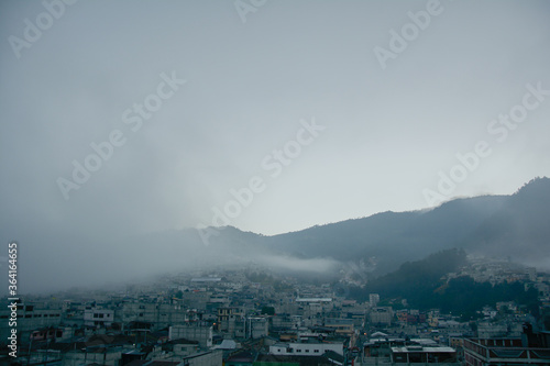 sunrise landscape with clouds and small town, village photo