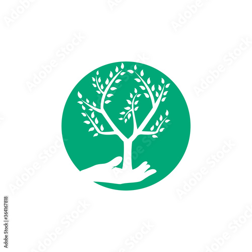 Tree in hand vector logo design. Natural products logo. Cosmetics icon. Spa logo.