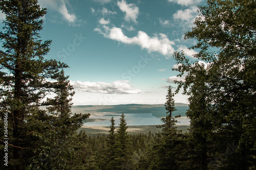 Beautiful landscape with a mountain range in nature and blue sky with white clouds © Oksy001