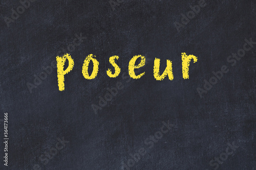 Black chalkboard with inscription poseur on in