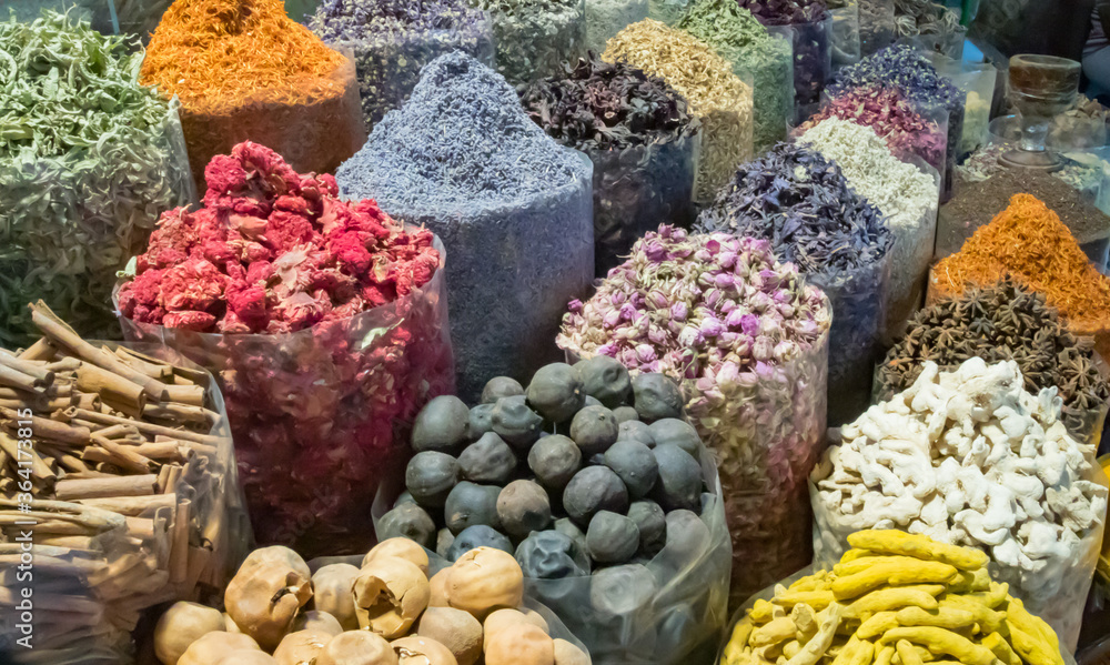 Rows of spice, herbs and healthy ingredients of various shapes and colors old Deira spice souk