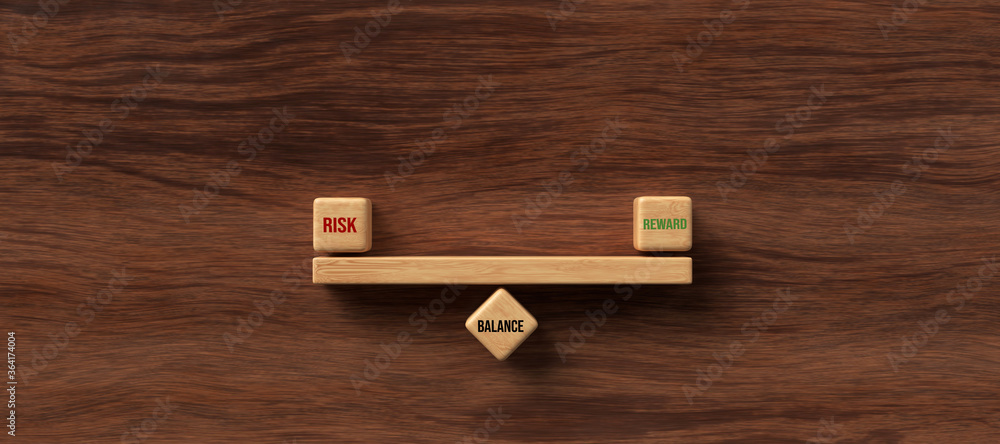 cubes forming scale with the words RISK, REWARD and BALANCE on wooden background cubes forming scale with the words RISK, REWARD and BALANCE on wooden background