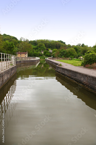 Beautiful canal in United Kingdom, featuring trees, water and boats