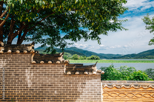 Korean traditional stone wall with river and mountain at Dumulmeori in Yangpyeong, Korea photo