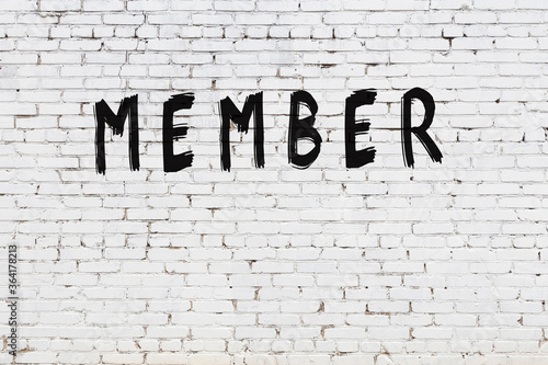 Inscription member painted on white brick wall photo