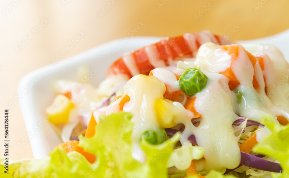 Vegan Salad or Vegetarian Salad include Peas and Corn and Tomato and Carrot and Cabbage and Lettuce with Mayonnaise on Wood Table at Side Frame with Natural Light Vegan Salad or Vegetarian Salad include Peas and Corn and Tomato and Carrot and Cabbage and Lettuce with Mayonnaise on Wood Table at Side Frame with Natural Light