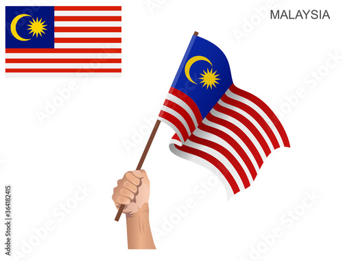 Malaysian state flag hoisted with a stick held by hand to inflame the spirit of statehood