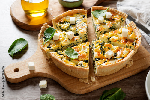 Vegetarian spinach pie or quiche with feta cheese . photo