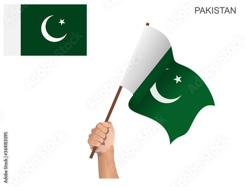Pakistani state flag raised with a stick held by hand to inflame the spirit of statehood