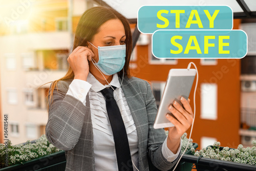 Text sign showing Stay Safe. Business photo showcasing secure from threat of danger, harm or place to keep articles Promoting health awareness with set of medical precautionary equipment photo