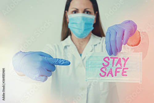 Writing note showing Stay Safe. Business concept for secure from threat of danger, harm or place to keep articles Laboratory blood test sample for medical diagnostic analysis photo