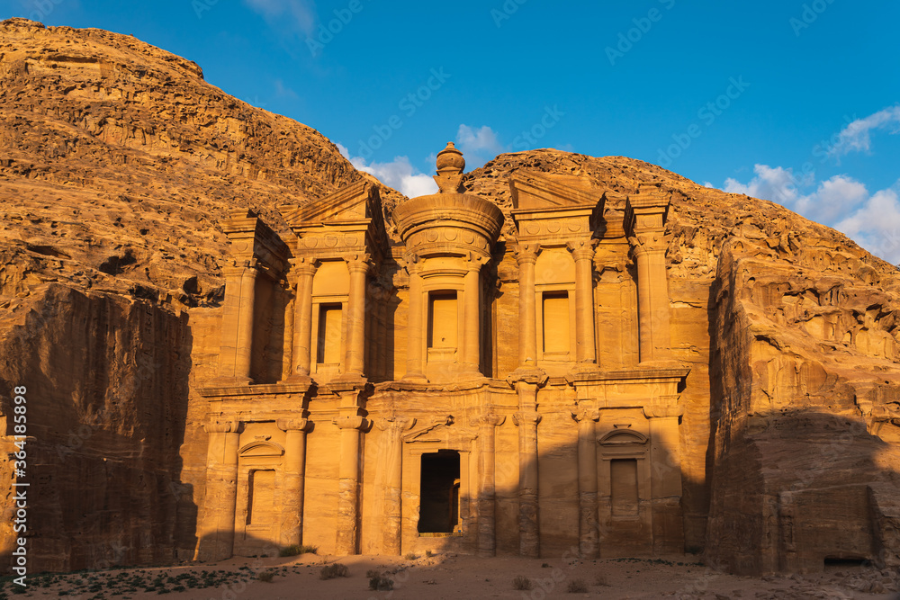 The Monastery or Ad Deir in Petra ruin and ancient city of Nabatean kingdom UNESCO world heritage site at sunset, Jordan, Arab