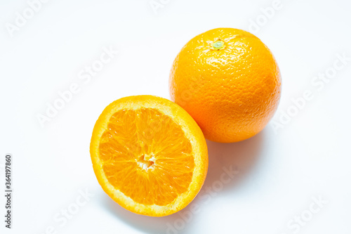 Sliced fresh orange fruit on white background