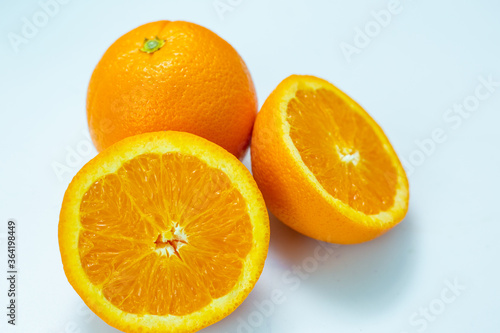 Sliced fresh orange fruit on white background