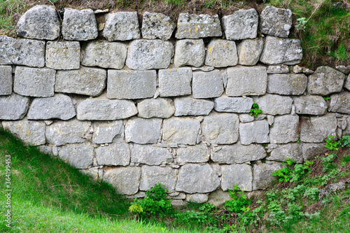 The stone wall of the monastery complex