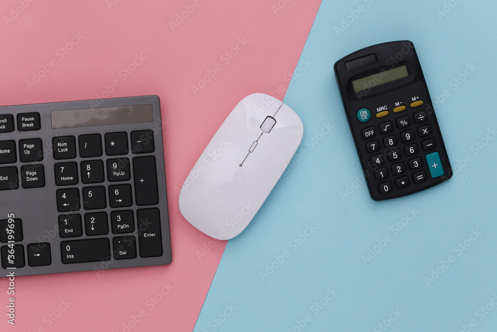 PC keyboard with calculator on pink blue pastel background. Online business. Top view PC keyboard with calculator on pink blue pastel background. Online business. Top view
