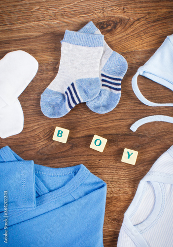 Word boy and clothing for newborn, concept of expecting for baby
