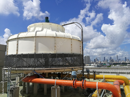 Counter Flow type Cooling tower with city view and blue sky - HVAC photo