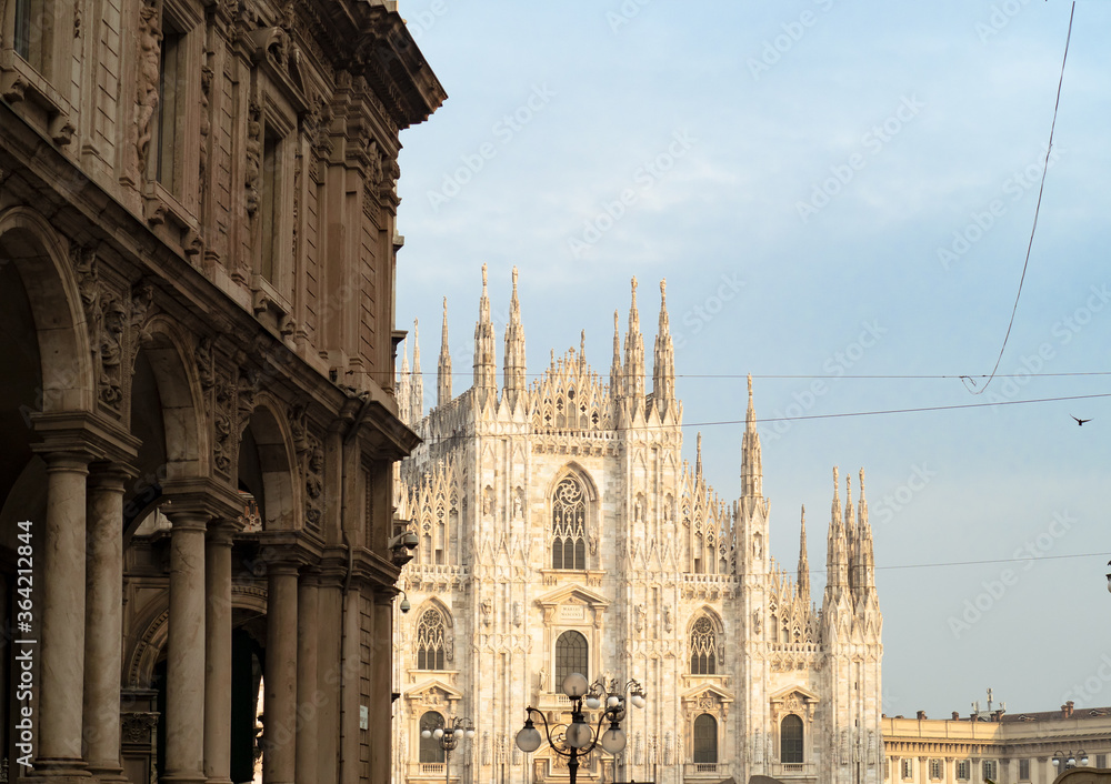 Duomo, Milan's cathedral illuminated by the rays of sunset
