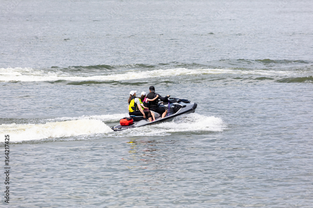 family ride a jet ski while on vacation family ride a jet ski while on vacation