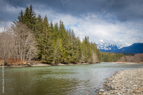 A deep green pool on the Kalum River, Skeena Region, in the spring, British Columbia, Canada photo