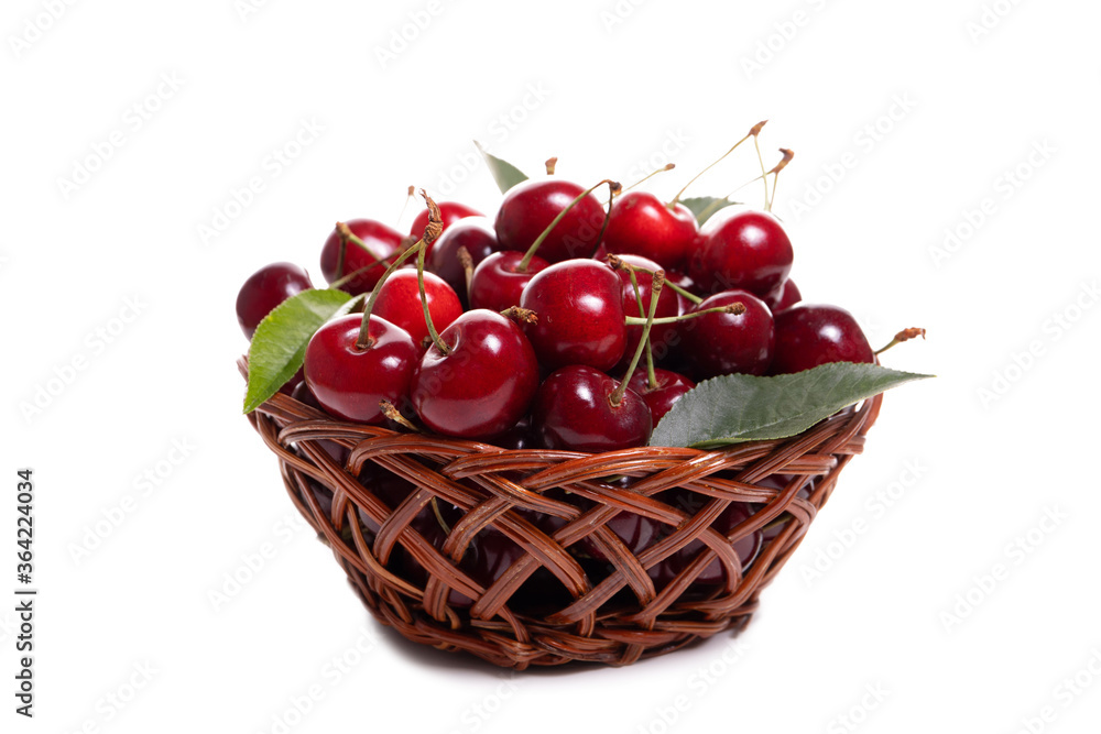Sweet cherries in a basket isolated on a white background Sweet cherries in a basket isolated on a white background