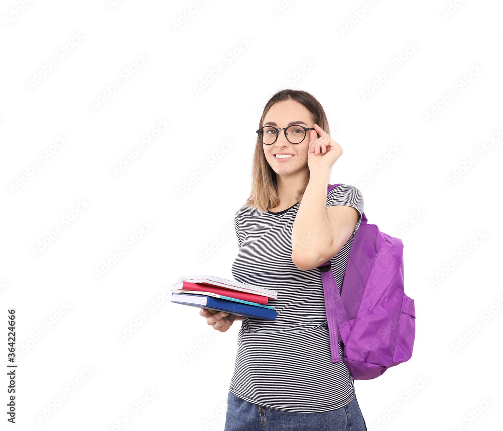 Beautiful girl student with a backpack holds notebooks in hands isolated on a white background Beautiful girl student with a backpack holds notebooks in hands isolated on a white background