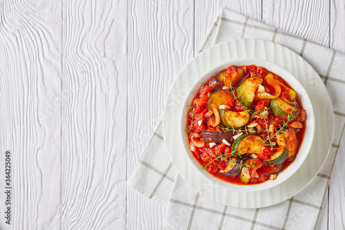 hot veggies ragout in a white bowl photo