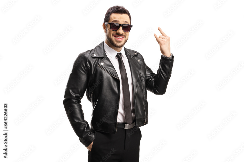 Young man in leather jacket gesturing a rock and roll sign Young man in leather jacket gesturing a rock and roll sign