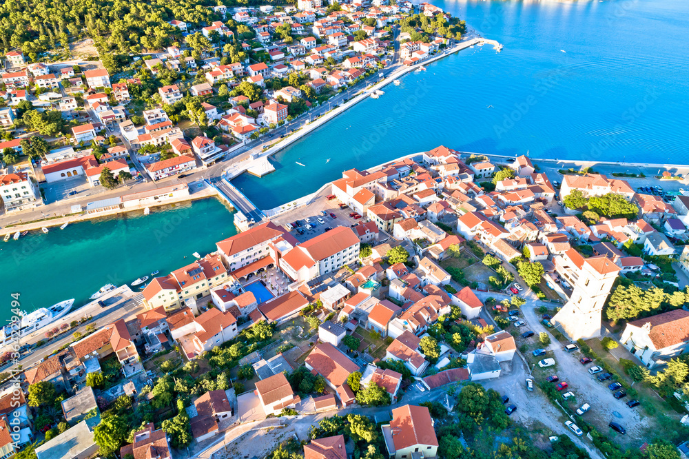 Coastal town of Tisno aerial panoramic view, bridge to island of Murter