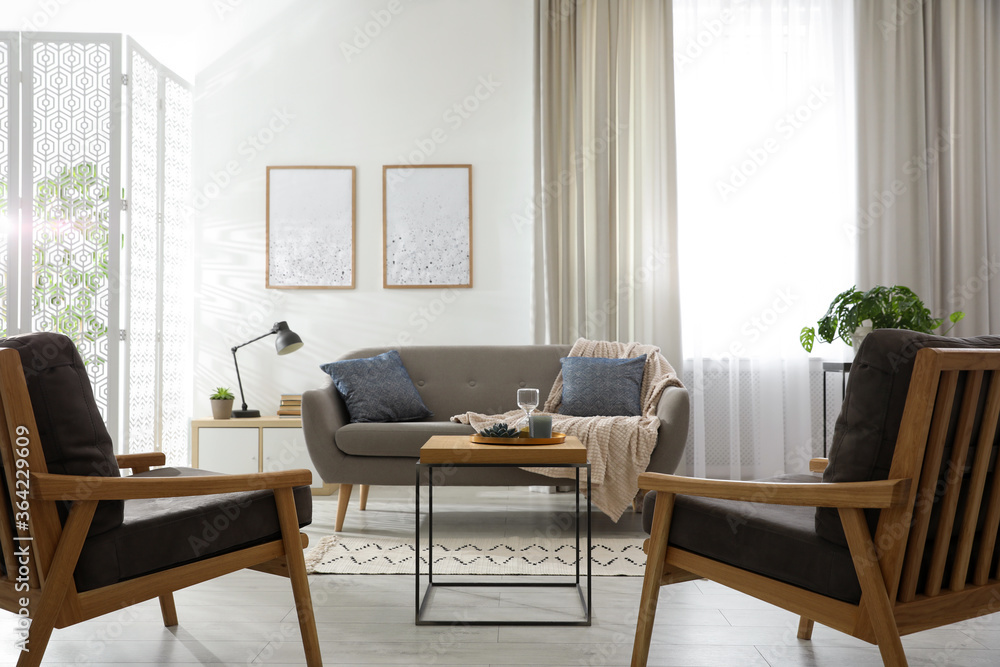 Modern living room interior with comfortable sofa and armchairs Modern living room interior with comfortable sofa and armchairs