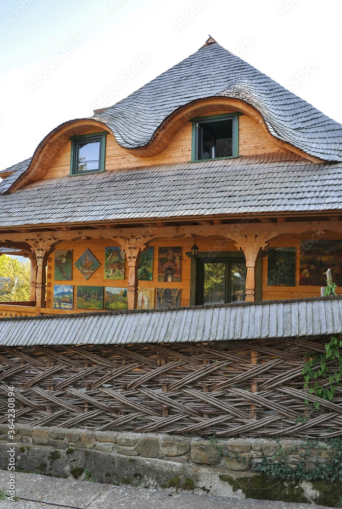 DESESTI, MARAMURES, ROMANIA, SUMMER 2018. Beautiful wooden houses on the way to the wooden orthodox church of San Parascheva or Desesti, Unesco World Heritage.