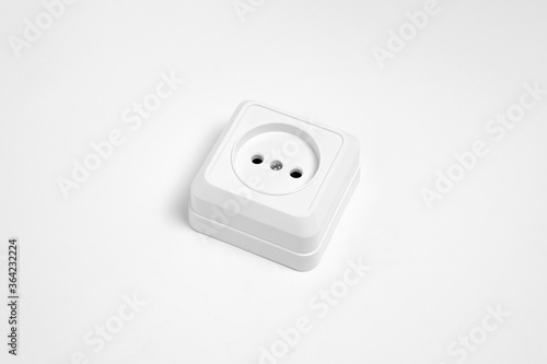 A white socket on white background.Electric plug. European high voltage 220W socket.High-resolution photo.