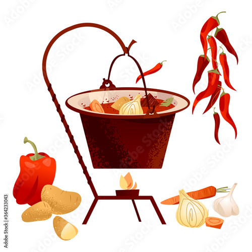 Traditional Hungarian dish. Goulash soup with meat, paprika, potatoes, onion, garlic and carrots served in the cauldron.