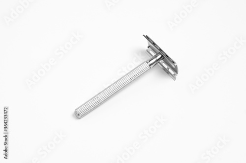 Vintage safety metal razor isolated on a white background. Shaving razor.High-resolution photo. © sabir