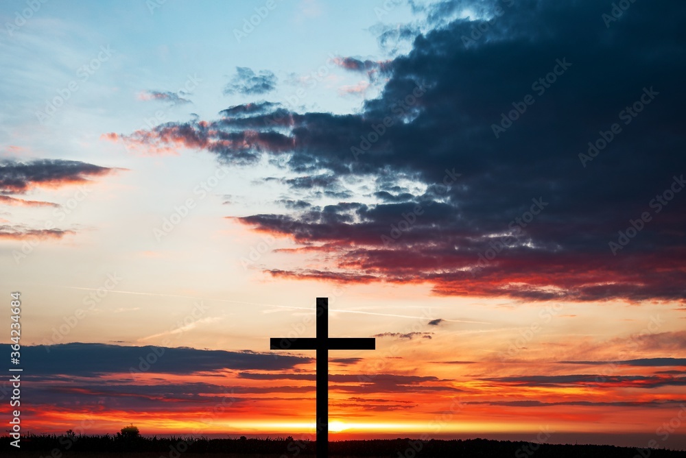 The cross of God in the rays of the sun. Background of religions