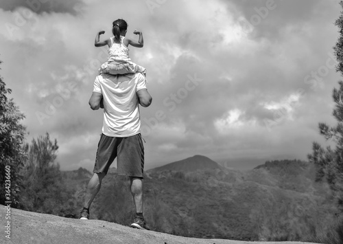 People standing on top of a mountain hike. Goals and achievement. photo