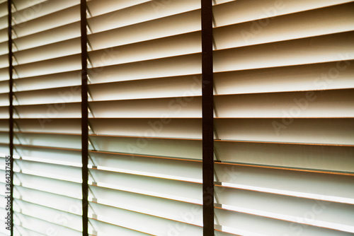 close up window wooden blind with daylight texture background home decorate ideas concept