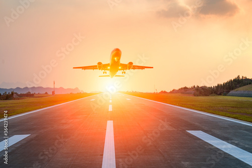 Runway, airstrip in the airport terminal with marking on blue sky with clouds background. Travel aviation concept