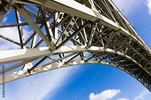 Iconic steel curve of Britannia Bridge a Grade II Listed structure, Isle of Anglesey, North Wales  © Liberty Photo Art
