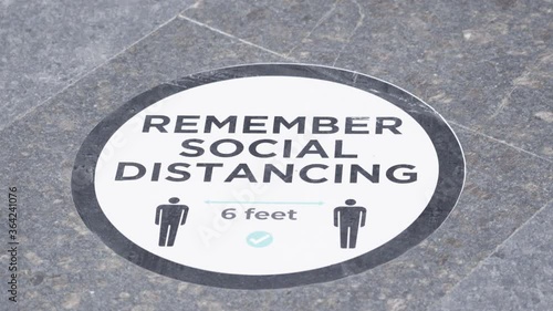 Social distancing poster sticker in malls of India to aware & to keep social distance. photo