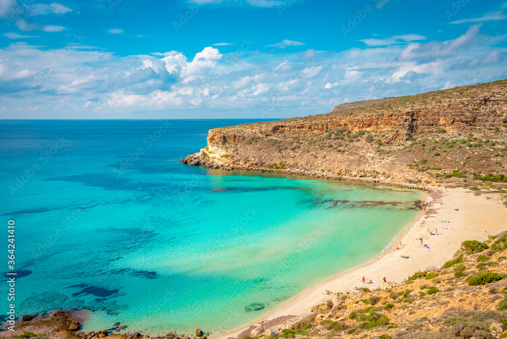 Crystal clear water at the pristine Rabbit’s beach (spiaggia dei conigli) in Lampedusa, Pelagie islands, Sicily