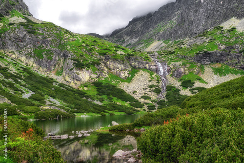 Fototapeta Naklejka Na Ścianę i Meble -  Tarn Velicke pleso and Velicky waterfall in High Tatras mountains, Slovakia