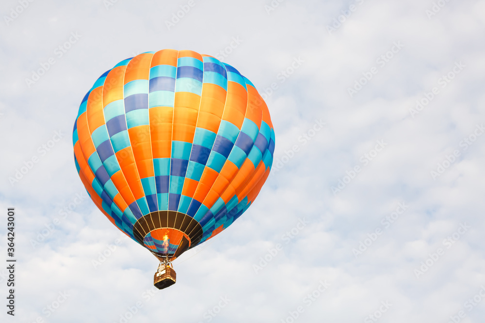 Fototapeta premium hot air balloon over blue sky. Composition of nature and blue sky background