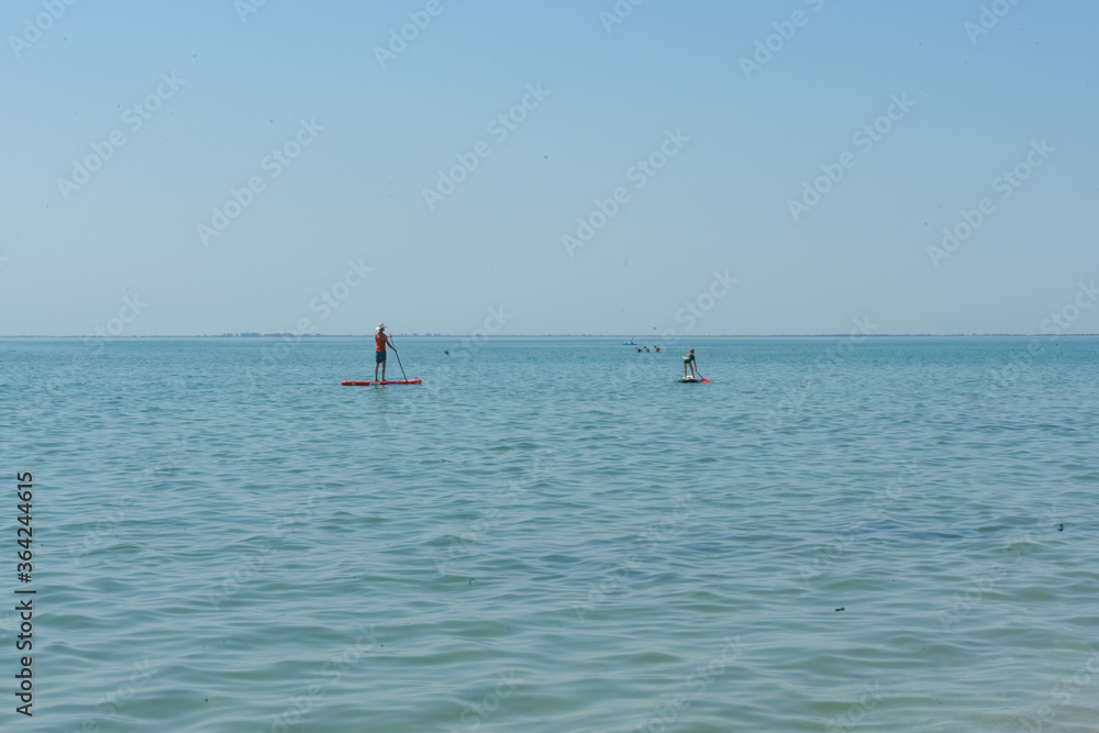 Kayaking. People are floating on a sea kayak. Adventure on the water.