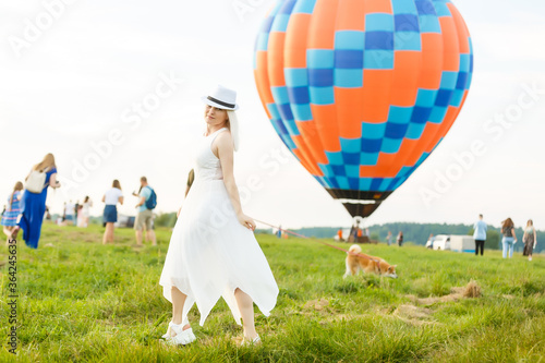 Amazing view with woman and air balloon. Artistic picture. Beauty world. The feeling of complete freedom