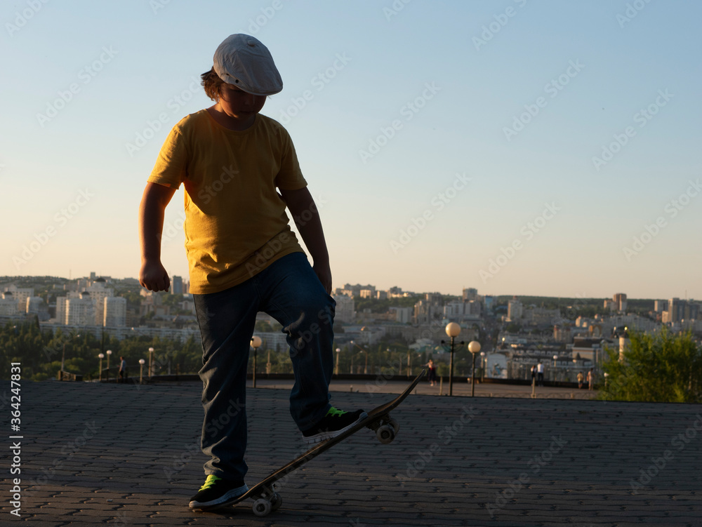 Boy Skateboarder doing jump trick in urban location