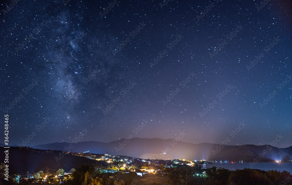 Starry night sky over the Gulf of Saint Florent, Corsica