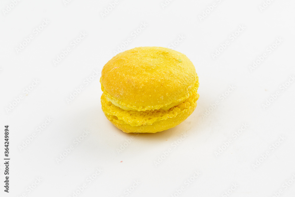 Yellow sweet macaroon on a white background Yellow sweet macaroon on a white background